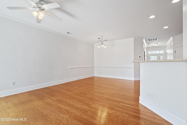7195 Bonaventure St SW Apt 104, Ocean Isle Beach, NC 28469 - empty room with ornamental molding, light wood finished floors, recessed lighting, baseboards, and a chandelier