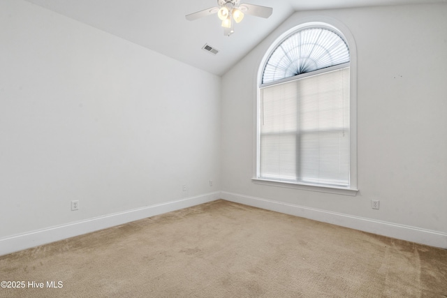 7195 Bonaventure St SW Apt 104, Ocean Isle Beach, NC 28469 - spare room with light carpet, vaulted ceiling, ceiling fan, and baseboards