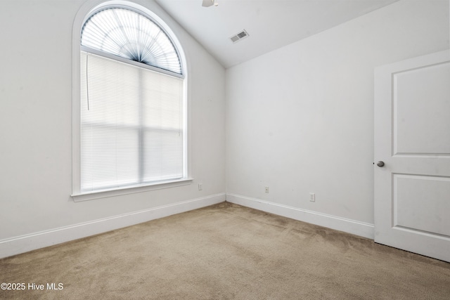 7195 Bonaventure St SW Apt 104, Ocean Isle Beach, NC 28469 - empty room with carpet, vaulted ceiling, and baseboards