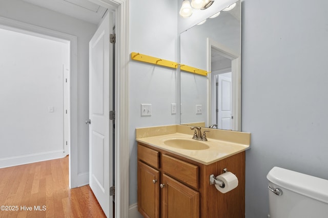 7195 Bonaventure St SW Apt 104, Ocean Isle Beach, NC 28469 - bathroom with toilet, wood finished floors, and vanity