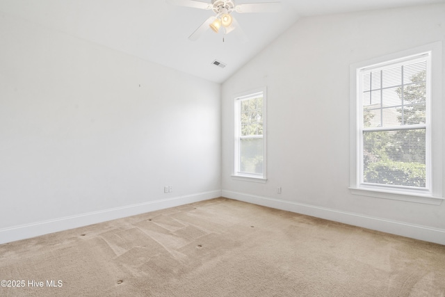 7195 Bonaventure St SW Apt 104, Ocean Isle Beach, NC 28469 - unfurnished room featuring light carpet, ceiling fan, baseboards, and lofted ceiling