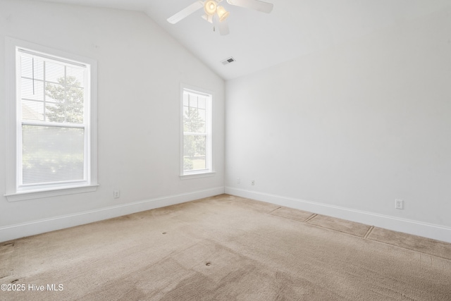 7195 Bonaventure St SW Apt 104, Ocean Isle Beach, NC 28469 - empty room with carpet, vaulted ceiling, ceiling fan, and baseboards