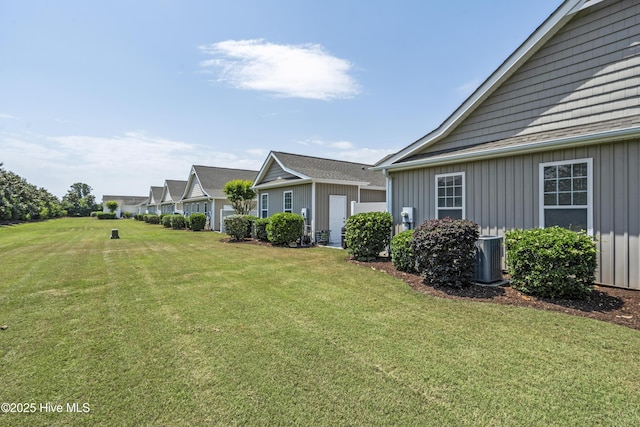 7195 Bonaventure St SW Apt 104, Ocean Isle Beach, NC 28469 - view of green lawn featuring central AC