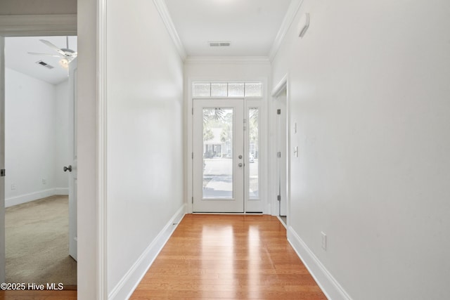 7195 Bonaventure St SW Apt 104, Ocean Isle Beach, NC 28469 - entryway featuring crown molding, a ceiling fan, light wood-style flooring, and baseboards