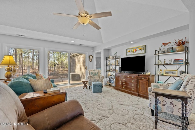 living room with vaulted ceiling and ceiling fan