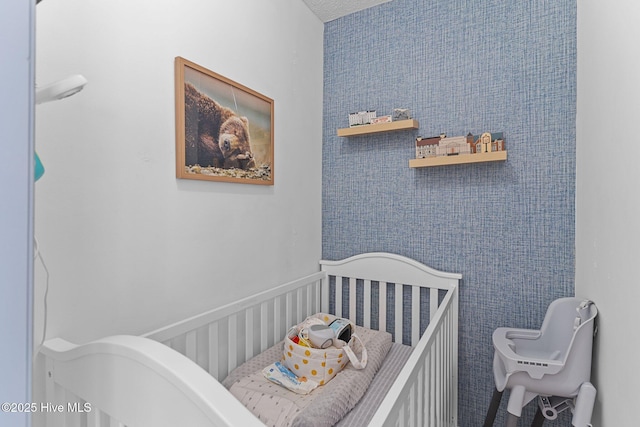 bedroom featuring a crib