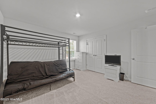 bedroom with baseboards and carpet floors