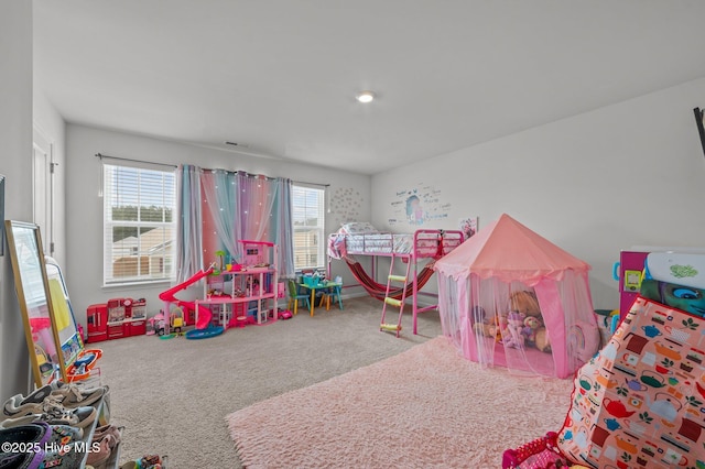 game room featuring visible vents, plenty of natural light, and carpet flooring