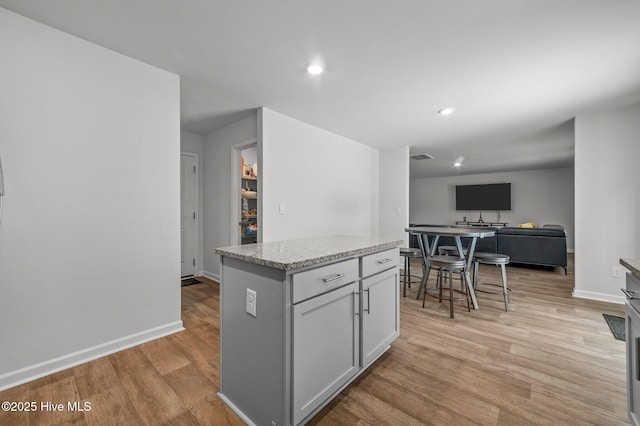 bathroom featuring hardwood / wood-style floors and a shower with shower door