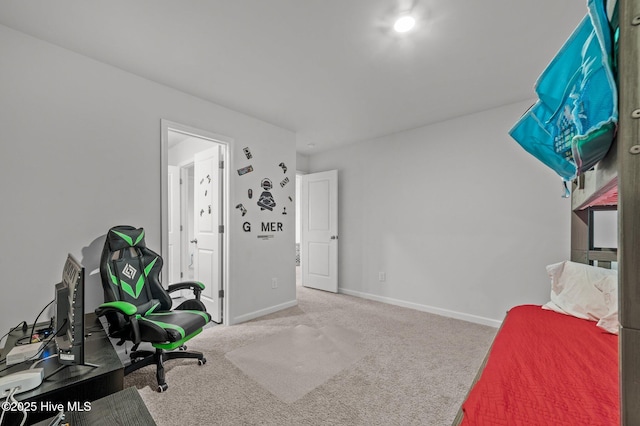 bedroom featuring baseboards and carpet floors