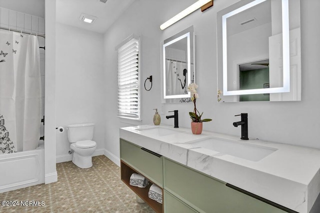bathroom with visible vents, baseboards, a sink, and toilet