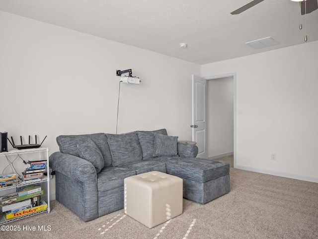 living room with carpet floors and ceiling fan