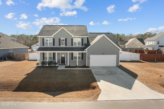 view of front facade with a porch, a garage, a front lawn, and central air condition unit