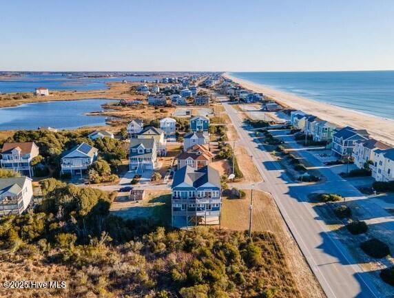 bird's eye view with a water view and a view of the beach