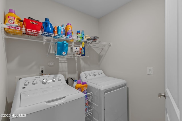 washroom featuring washer and dryer