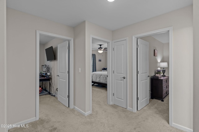 hallway with light colored carpet