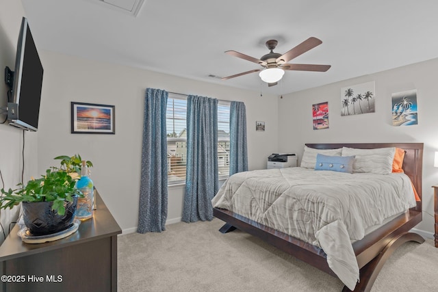 bedroom with light colored carpet and ceiling fan