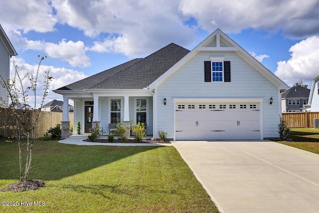 craftsman-style home featuring covered porch and a front lawn