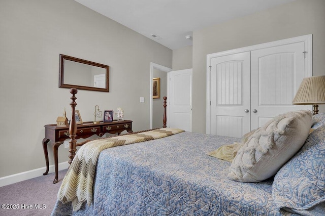 bedroom with carpet and a closet