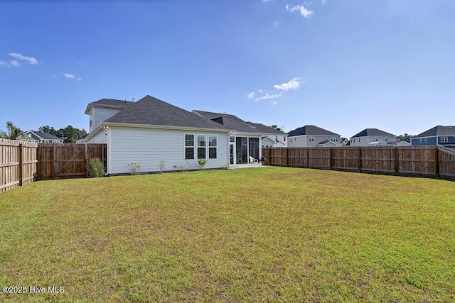 back of house featuring a yard