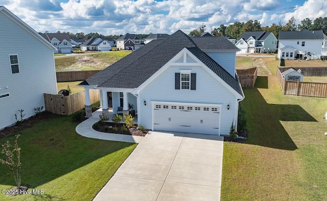 view of front of house with a garage and a front yard