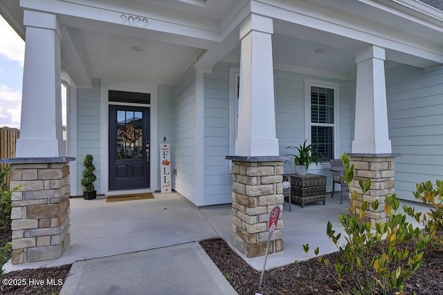 doorway to property with covered porch