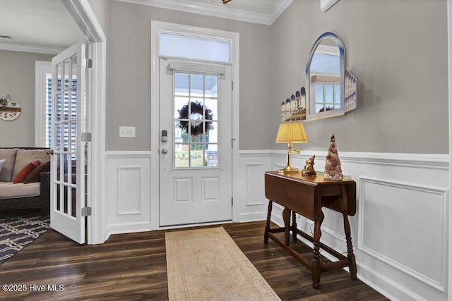 foyer entrance featuring dark hardwood / wood-style flooring and crown molding