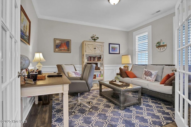 interior space featuring hardwood / wood-style flooring, ornamental molding, and french doors