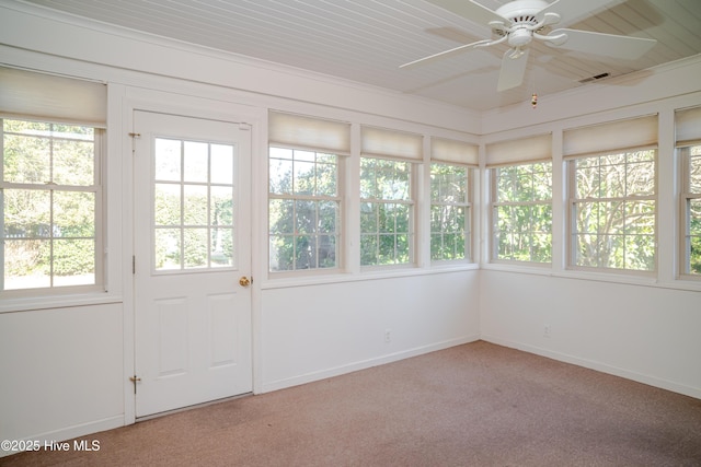 unfurnished sunroom featuring ceiling fan