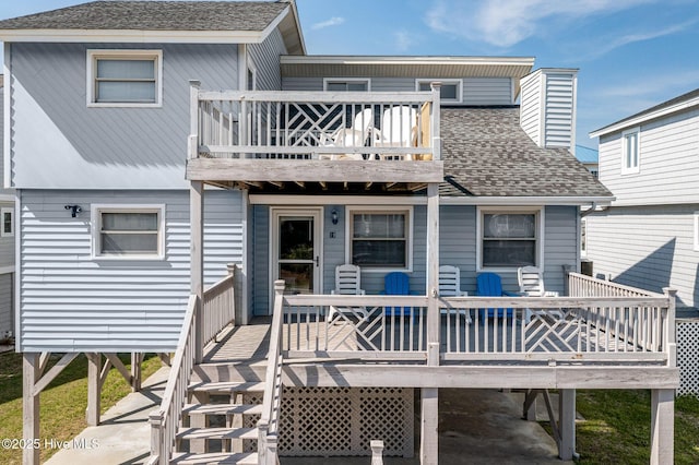 rear view of house featuring a balcony