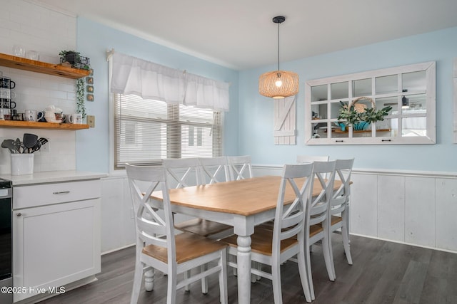 dining space with dark wood-type flooring