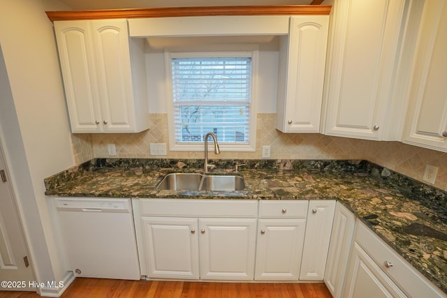 kitchen with white cabinetry, dishwasher, and a sink