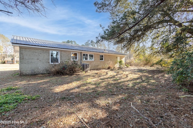 back of property featuring cooling unit