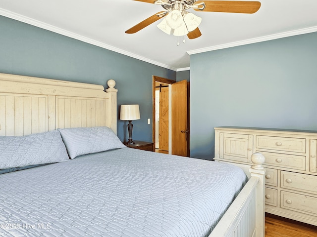 bedroom with ceiling fan and crown molding