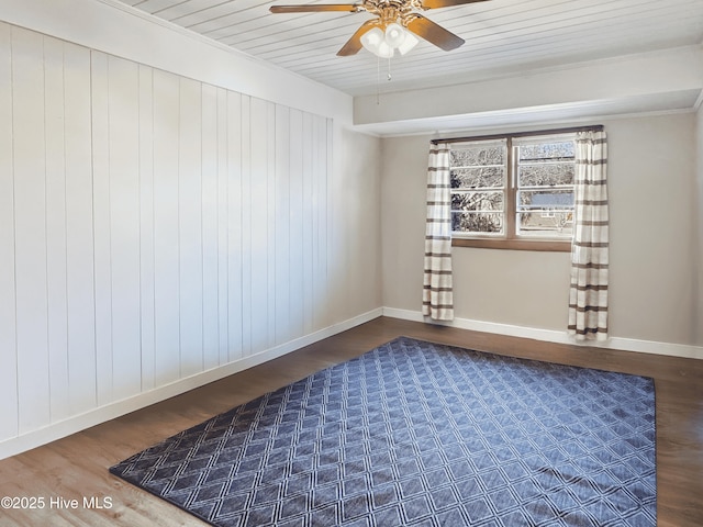 empty room featuring crown molding, hardwood / wood-style floors, ceiling fan, and wood ceiling