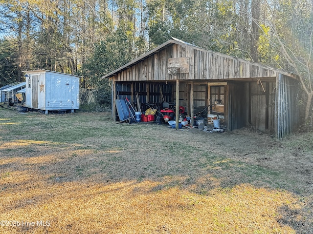 view of outbuilding with a lawn