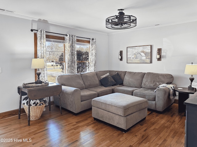 living room with ceiling fan, dark hardwood / wood-style floors, and crown molding