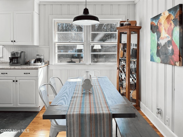 dining space featuring dark hardwood / wood-style floors