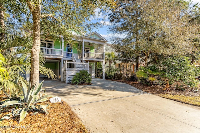 beach home featuring a carport and a porch