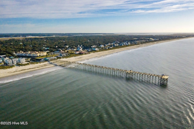 bird's eye view featuring a water view and a beach view