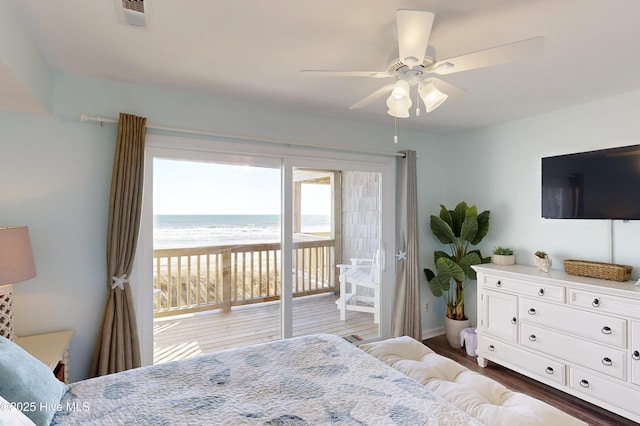 bedroom featuring dark hardwood / wood-style flooring, access to outside, and ceiling fan