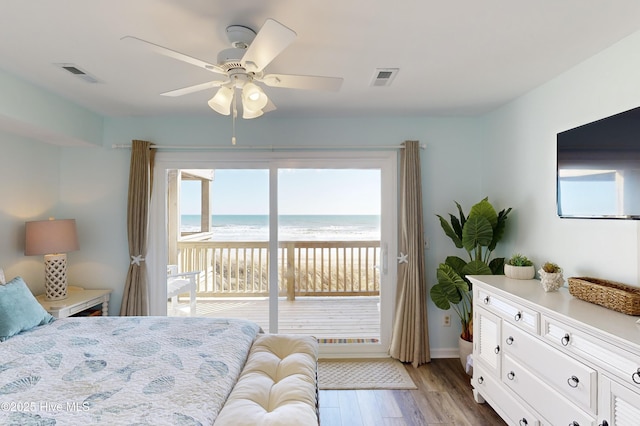 bedroom featuring access to outside, ceiling fan, and light wood-type flooring