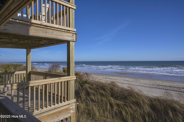 property view of water featuring a beach view