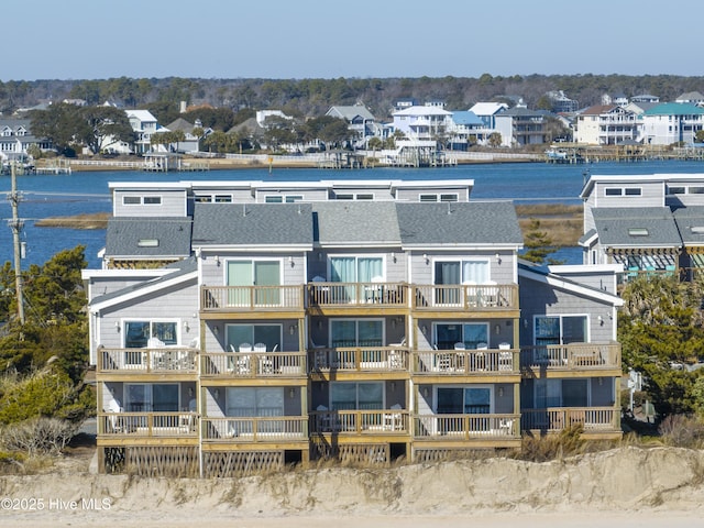 birds eye view of property with a water view