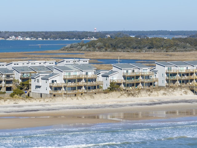 aerial view with a water view and a view of the beach