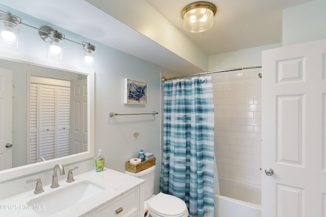 full bathroom with shower / bath combination with curtain, vanity, and toilet