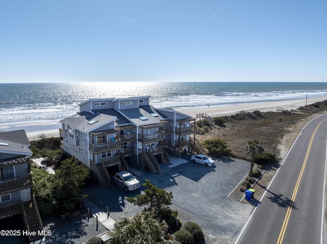 bird's eye view featuring a water view and a view of the beach