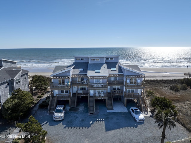 exterior space with a beach view and a water view