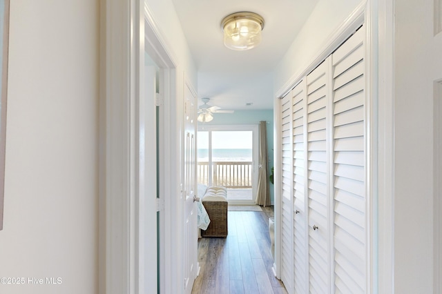 corridor with light hardwood / wood-style flooring