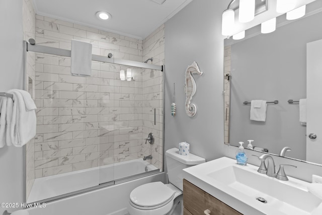 full bathroom featuring bath / shower combo with glass door, vanity, and toilet